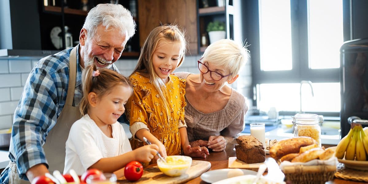 grandparents enoying cooking with grandchildren 