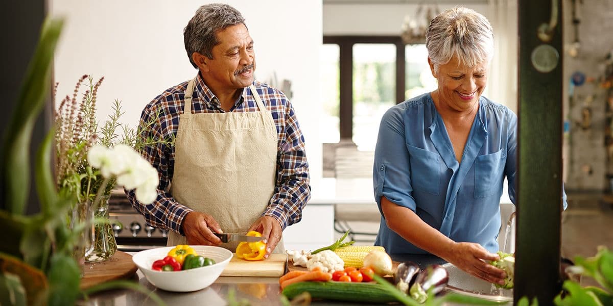 senipr couple cooking together