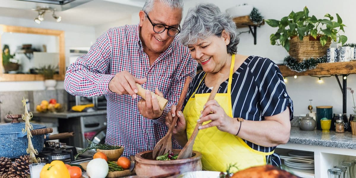 senior couple cooking together