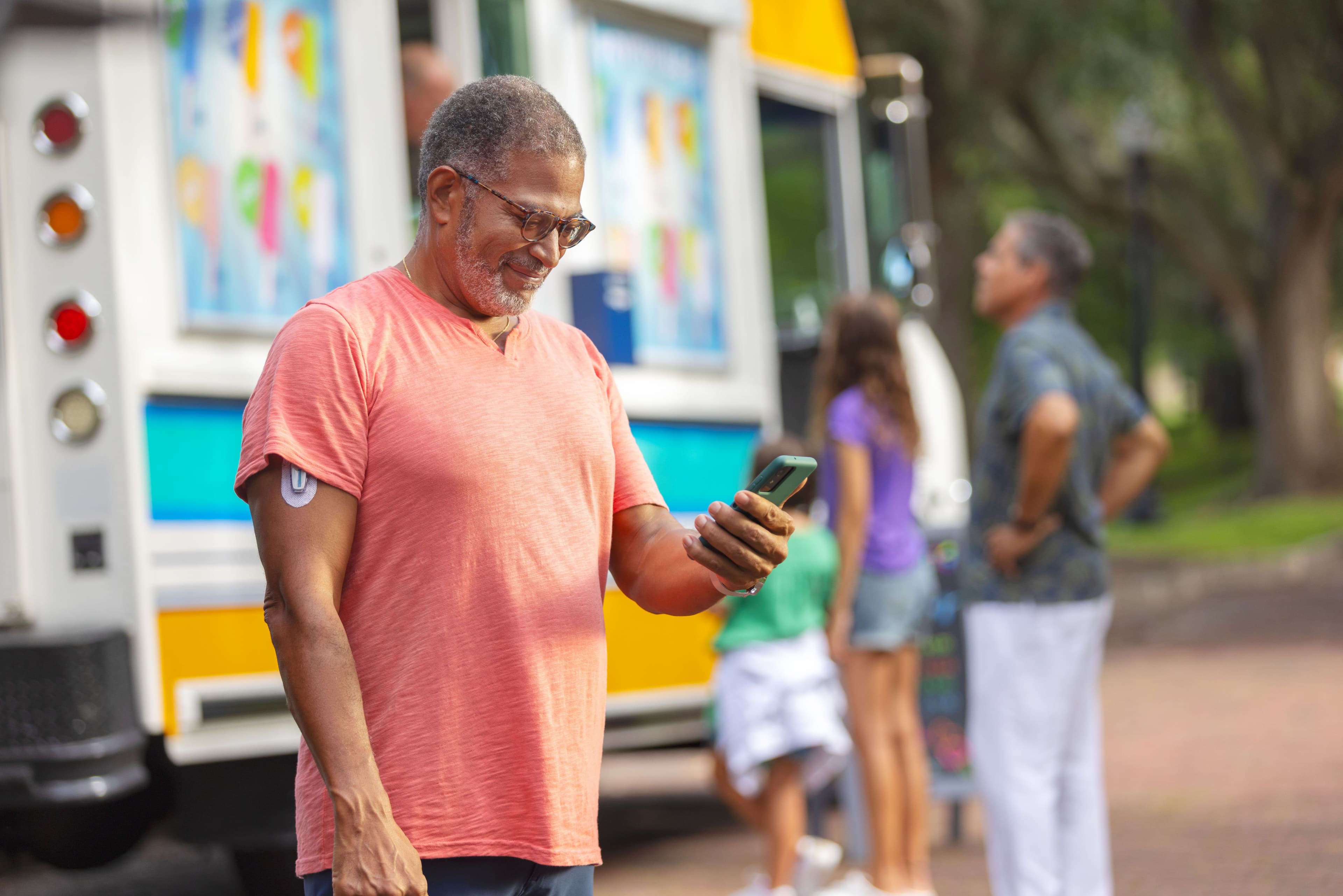 Black male outdoors near ice cream truck