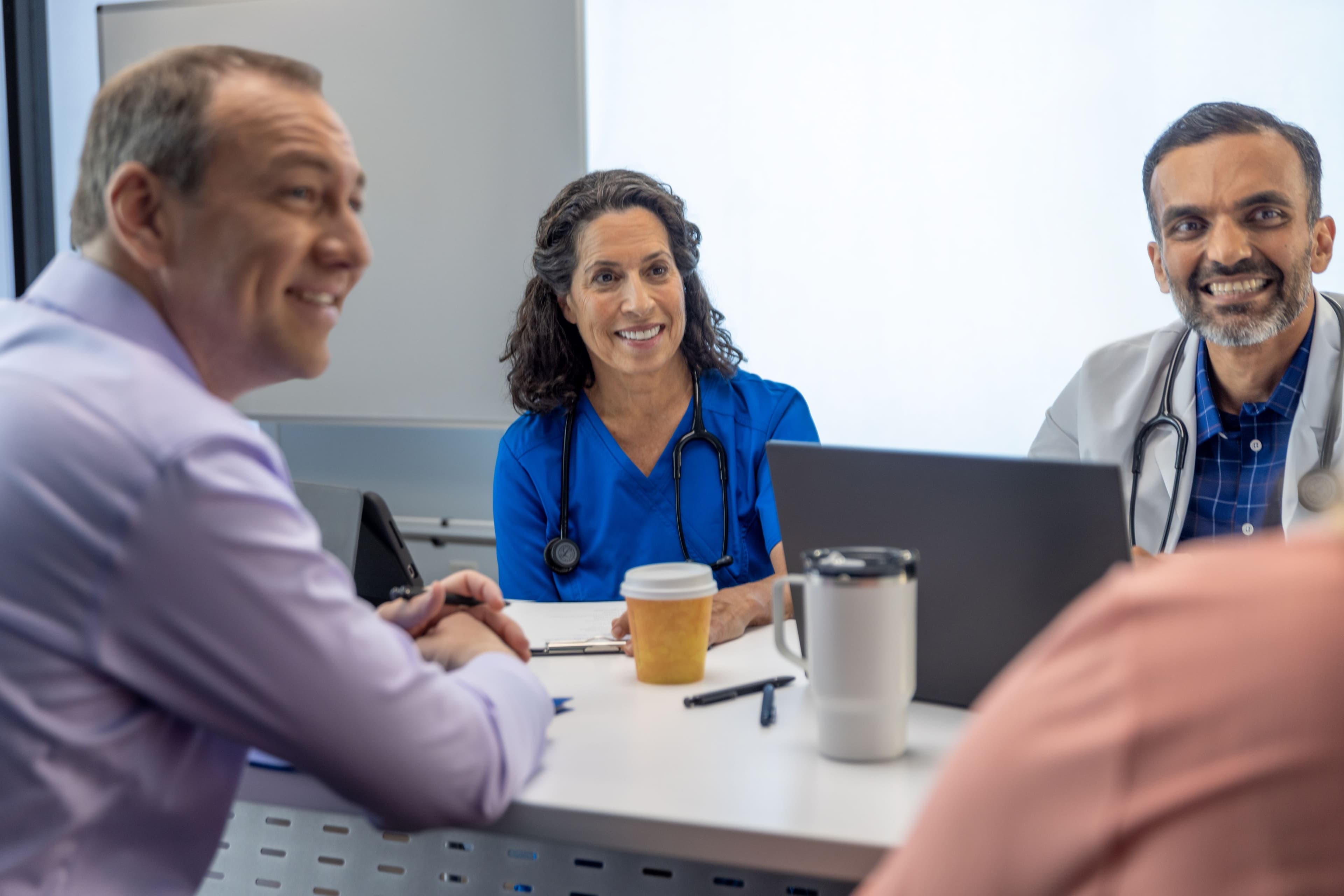 Doctor nurse and administrative staff in conference room