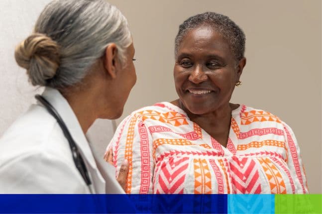 Woman sitting with her doctor