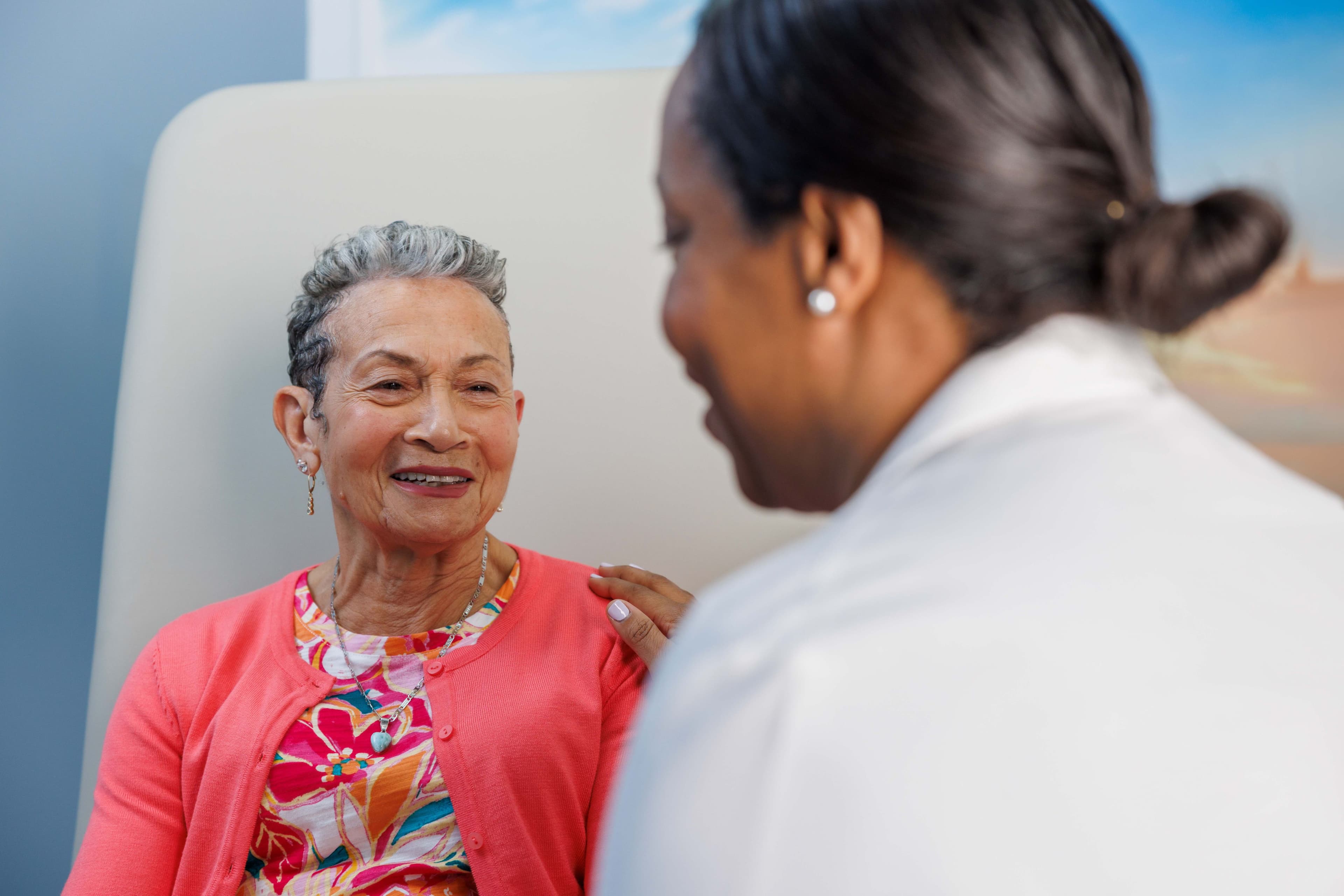 Woman sitting with her doctor