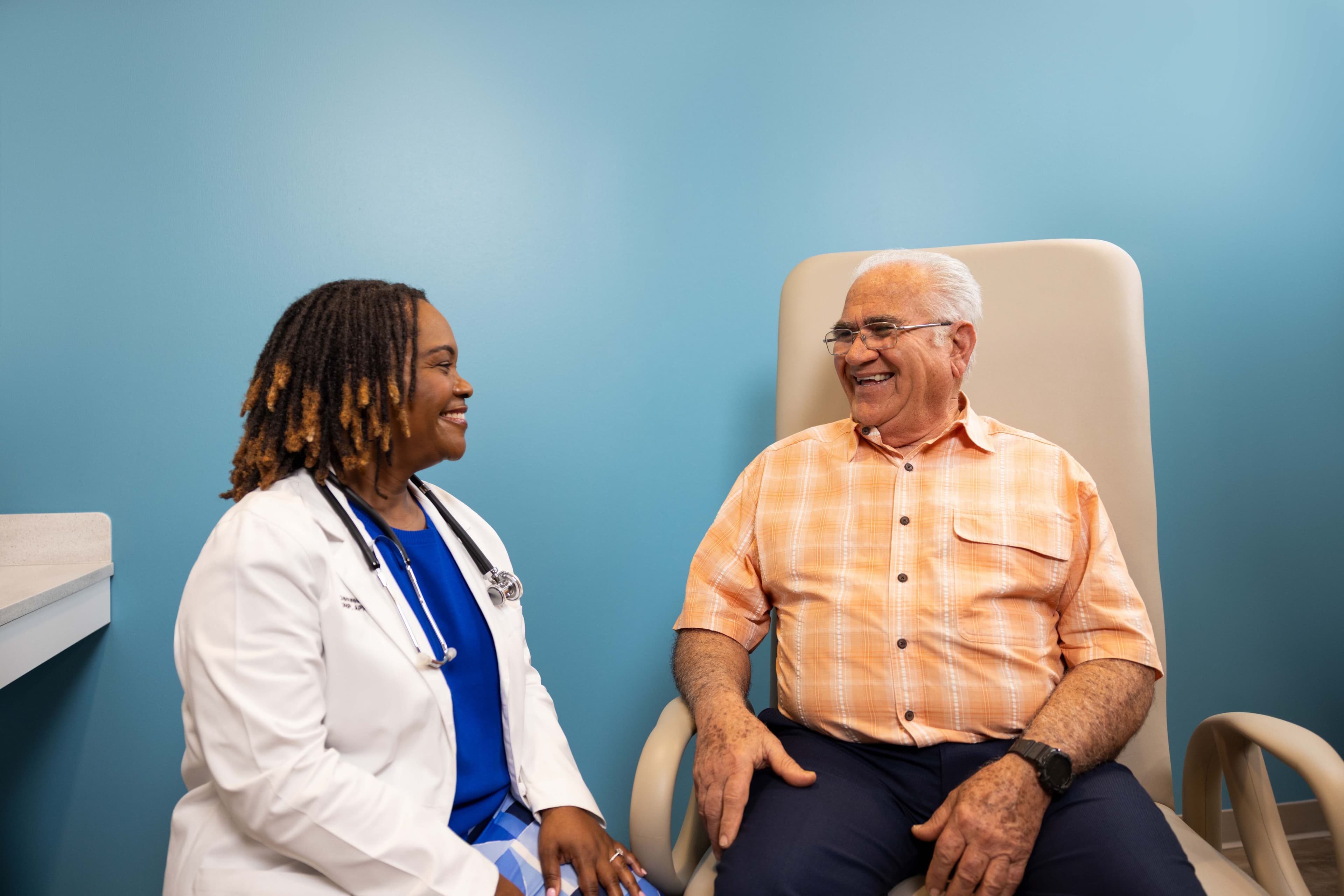 Woman sitting with her doctor