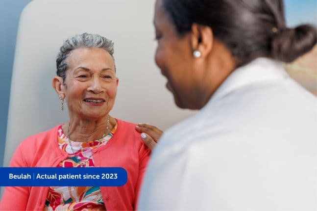Woman sitting with her doctor